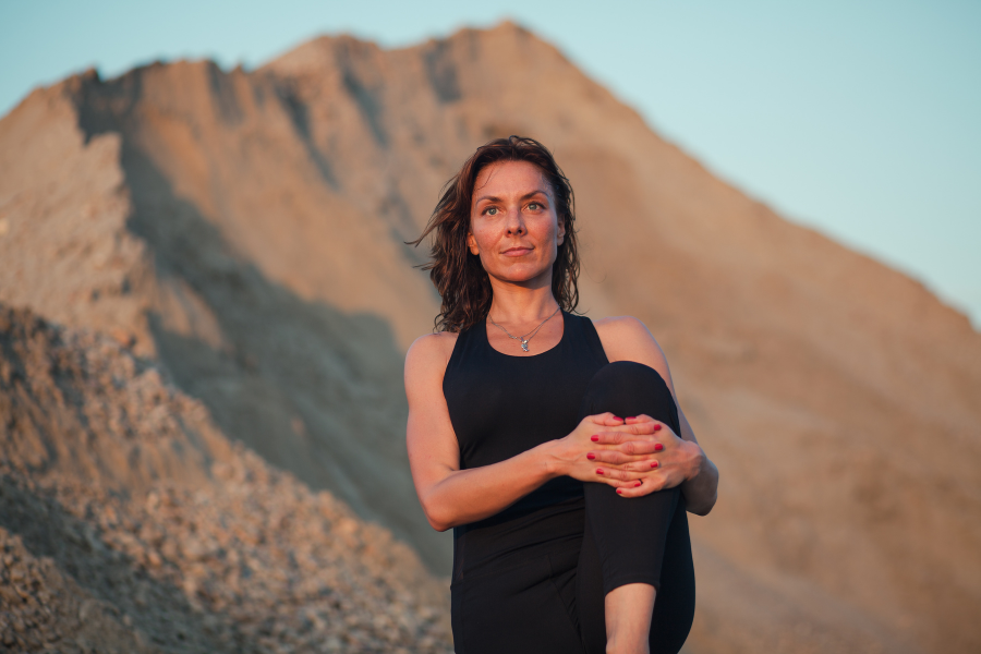 Woman exercising with mountains in background. Exercise physiologist Caloundra